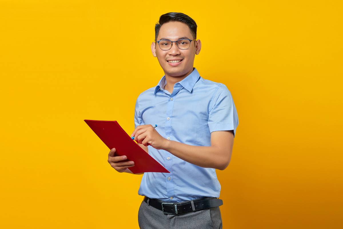 purchasing and procurement specialist reviewing digital contracts on laptop with supply chain analytics dashboard